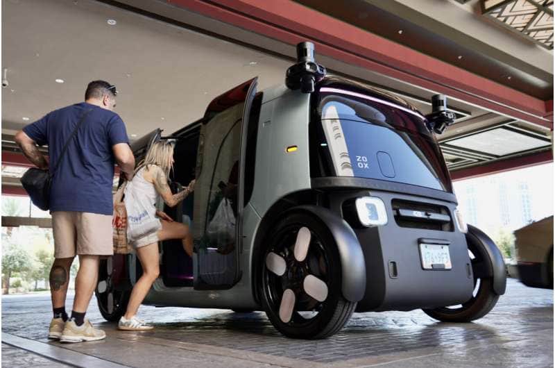 Passengers load into an Amazon Zoox taxi with no steering wheel Thursday, July 30, 2026, in Las Vegas. Credit: AP Photo/Ty ONeil