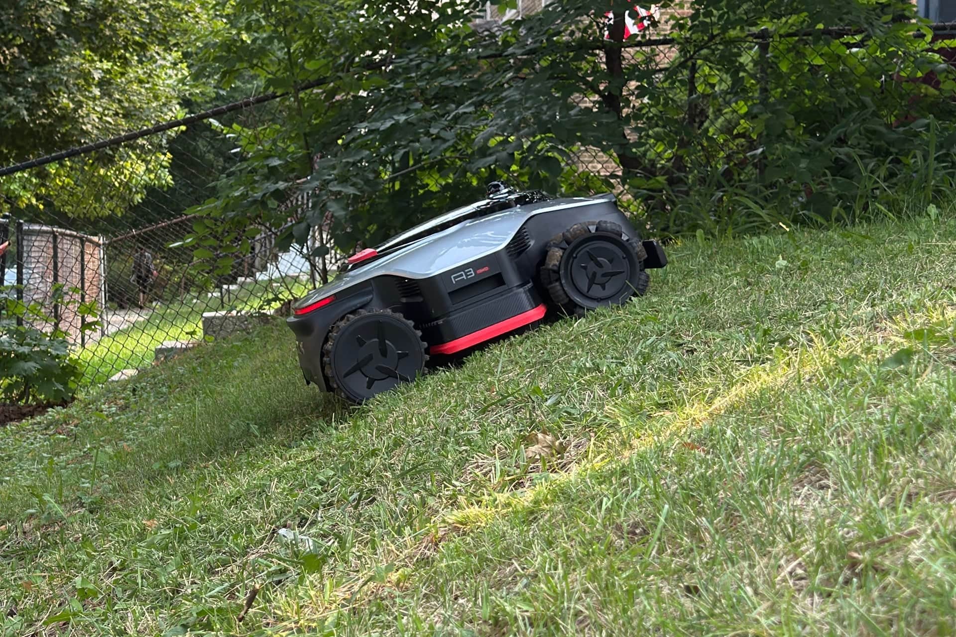 Dreame A3 AWD Pro 3500 climbing a steep incline — © Wes Davis / Gizmodo