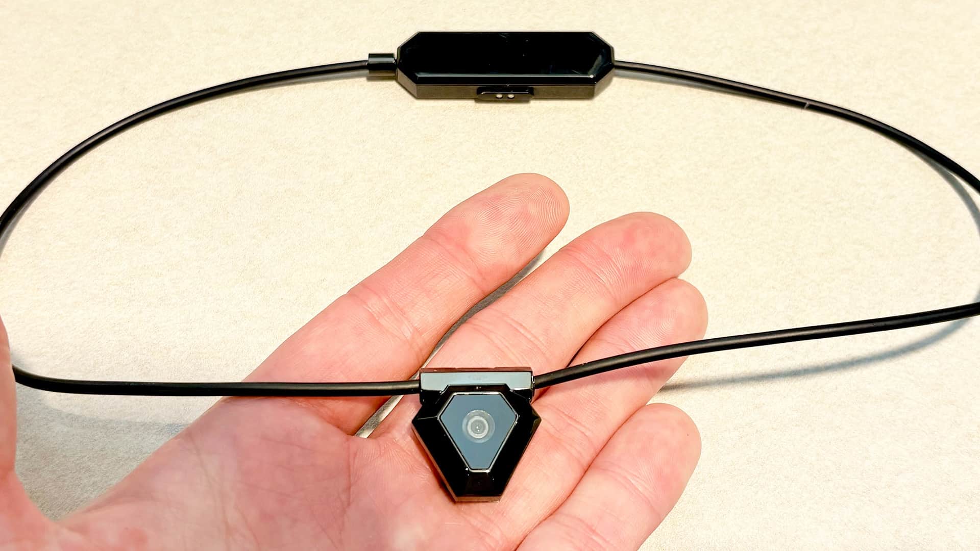 Close-up of the Odyss N1 AI-powered necklace that tracks what you eat — Image credit: Dan Bracaglia/Tom's Guide