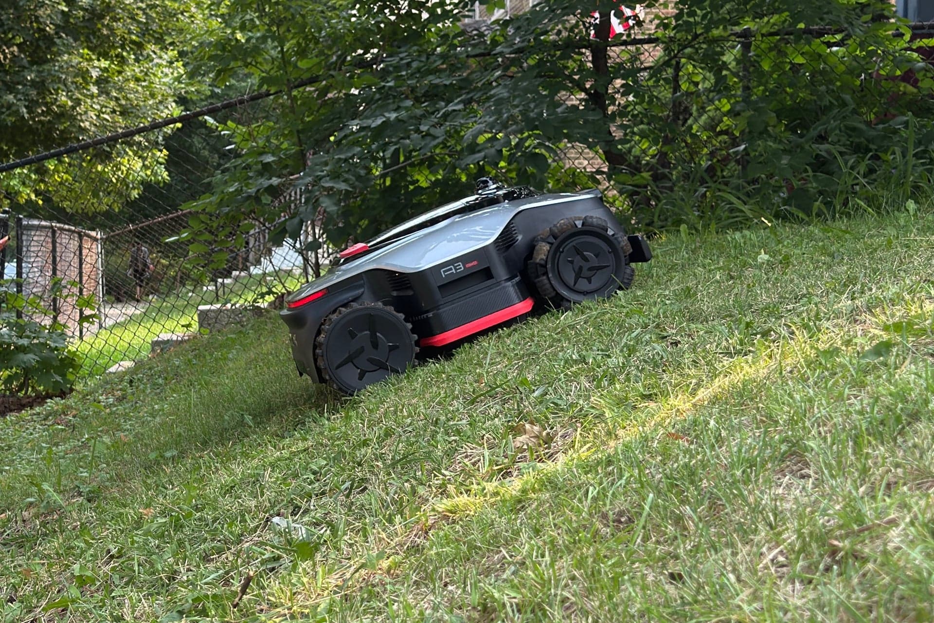 Dreame A3 AWD Pro 3500 climbing a steep incline — © Wes Davis / Gizmodo
