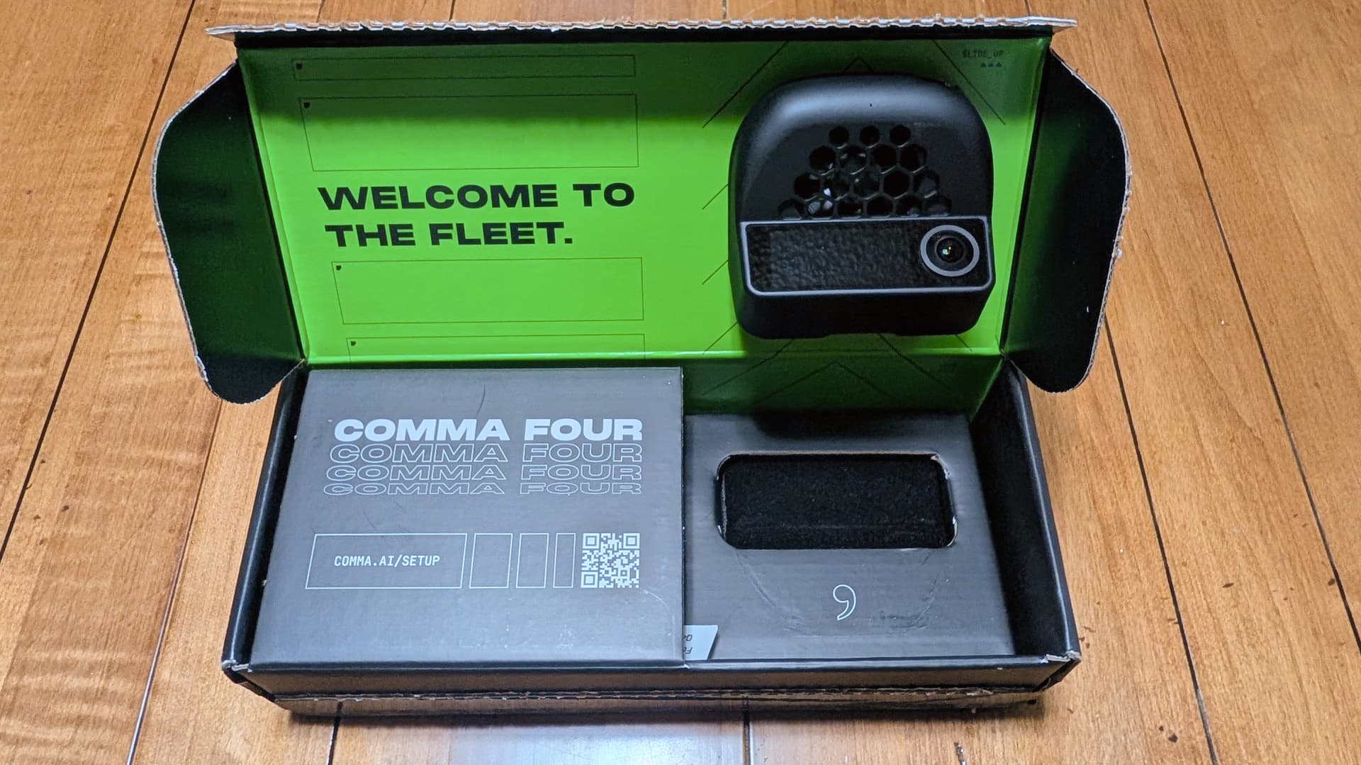 Comma Four in its box