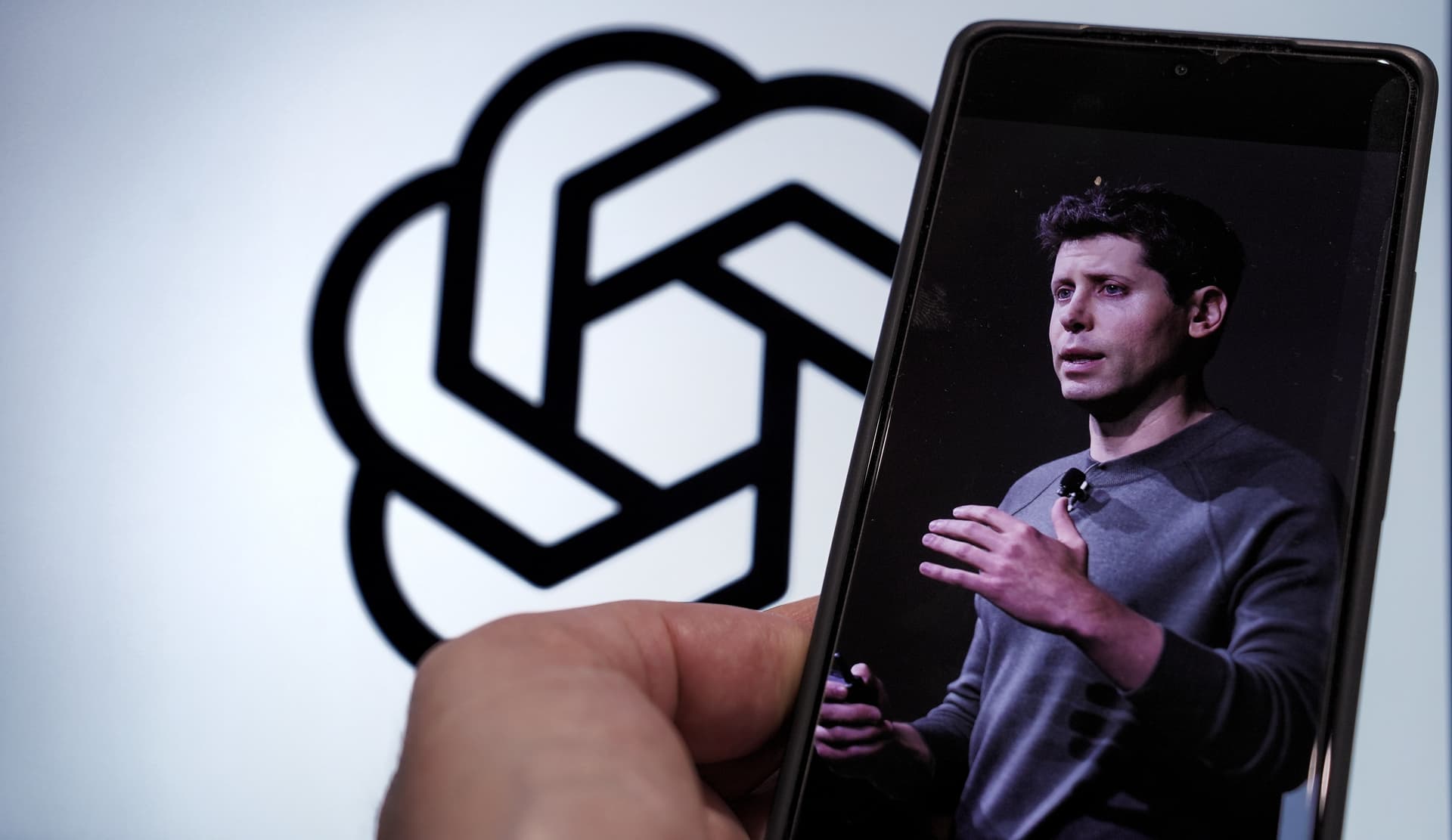 OpenAI CEO Sam Altman using ChatGPT and X on a phone in Sarajevo, Bosnia and Herzegovina, February 12, 2025 — Image credit: Shutterstock