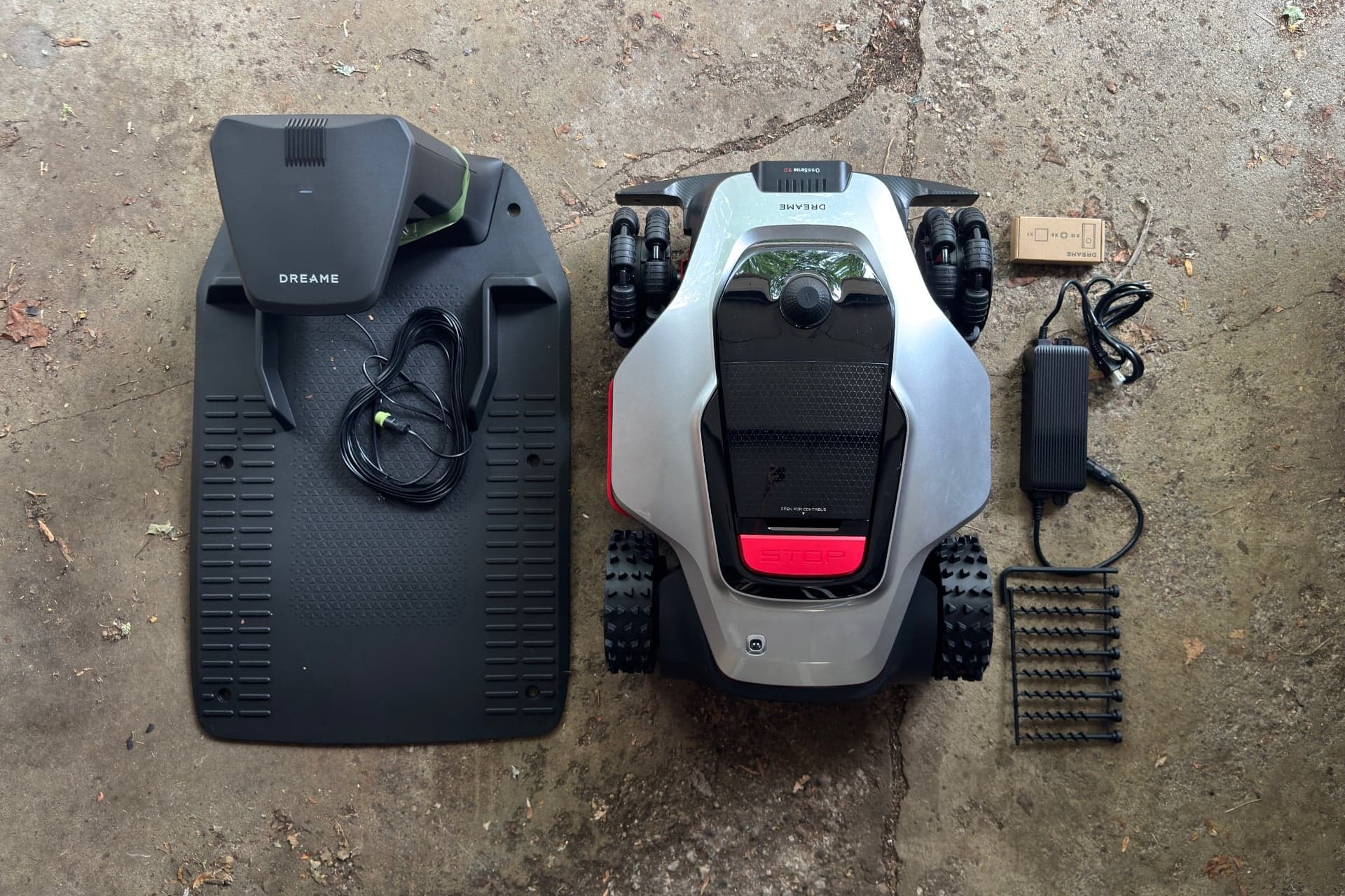 Dreame A3 AWD Pro photographed with its dock, robot, hardware box, power adapter, and dock screws — © Wes Davis / Gizmodo