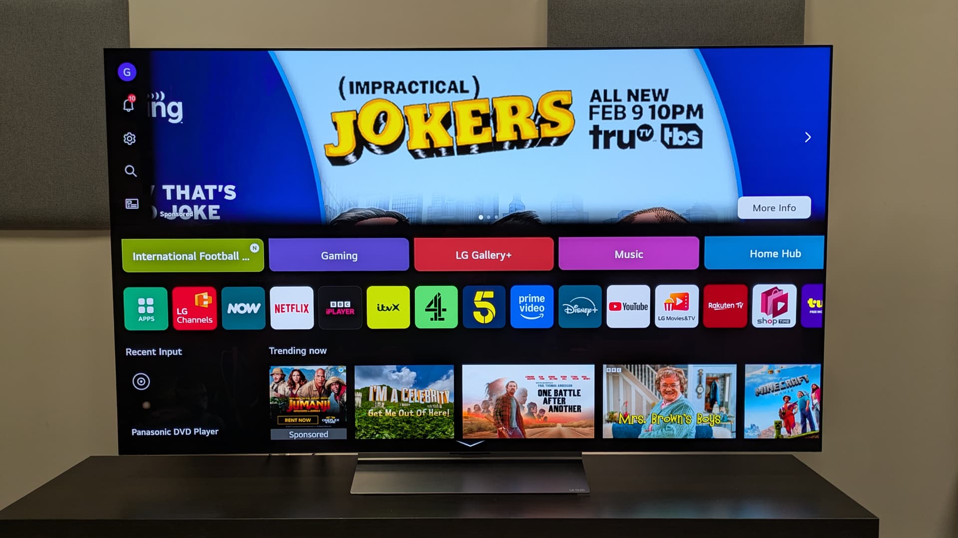 The LG C6 OLED TV with the webOS 26 home page on screen. Apps are well laid out but there is a large banner ad at the top of the screen — The software interface on the LG C6 Image credit: Future