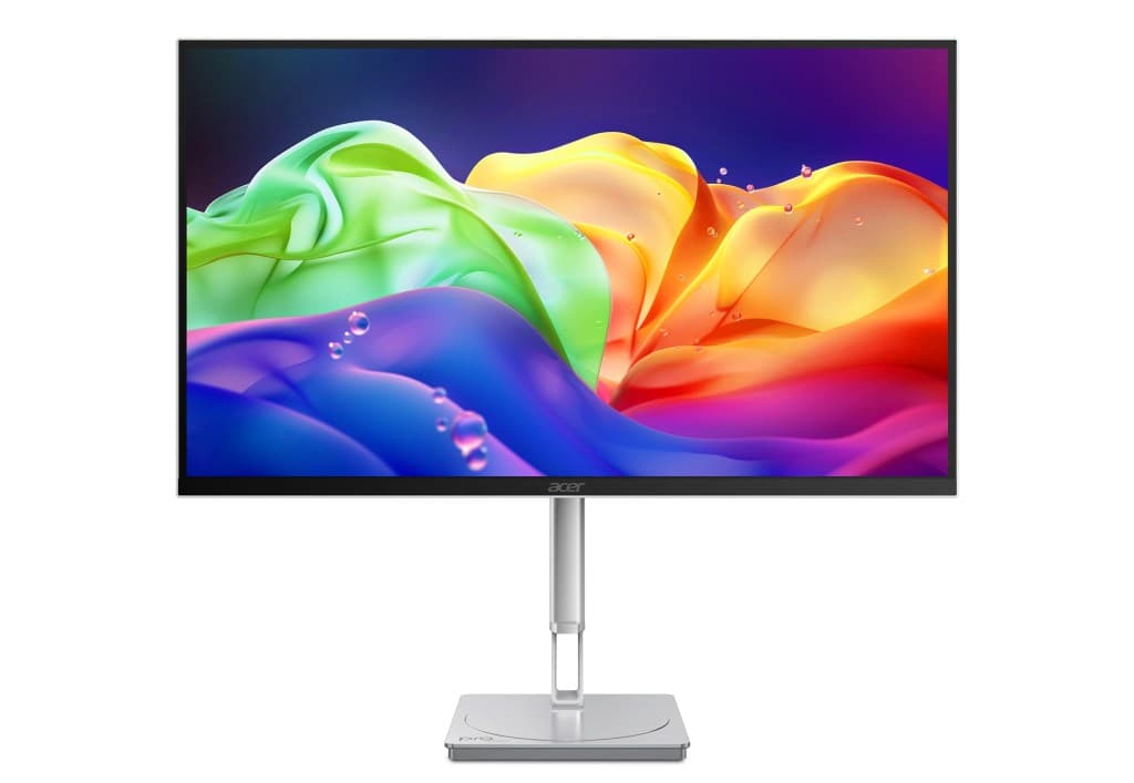 An Acer monitor displays colorful abstract waves in green, yellow and purple.