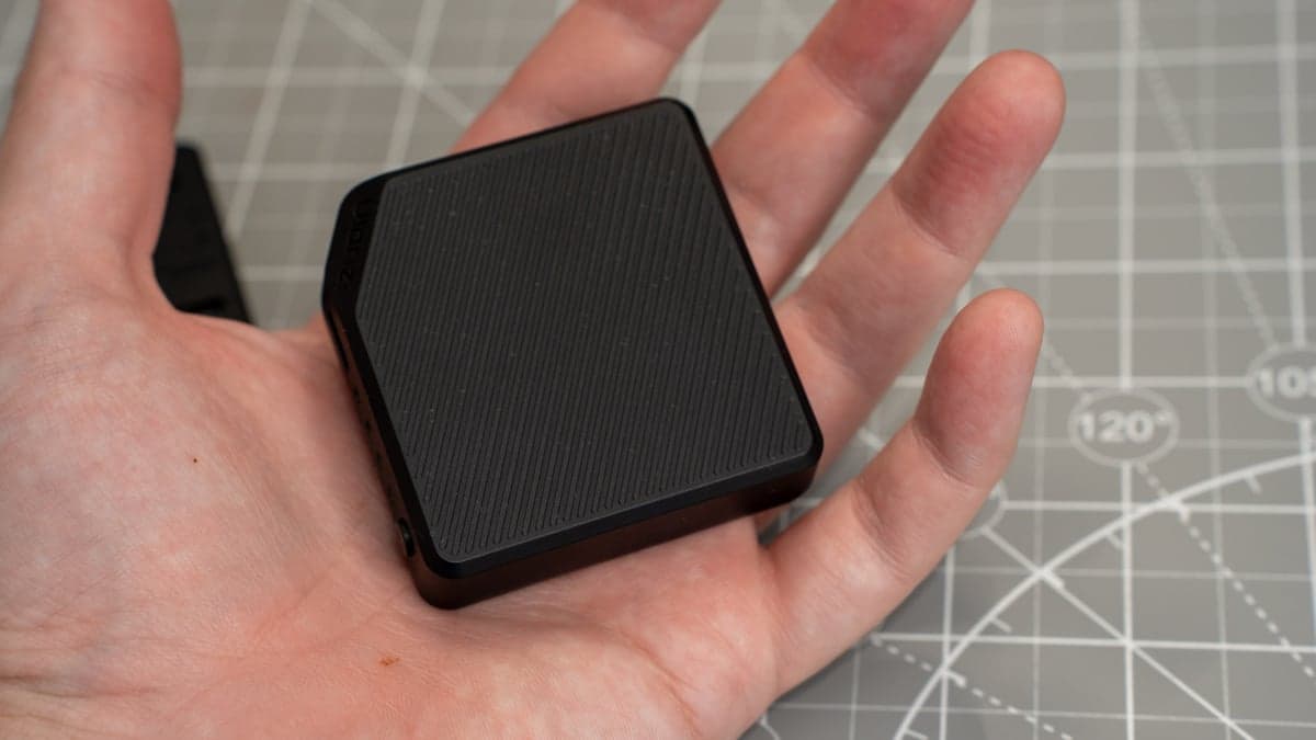 Compact scale of the modular 3,000mAh magnetic battery pack resting easily in the palm of a hand