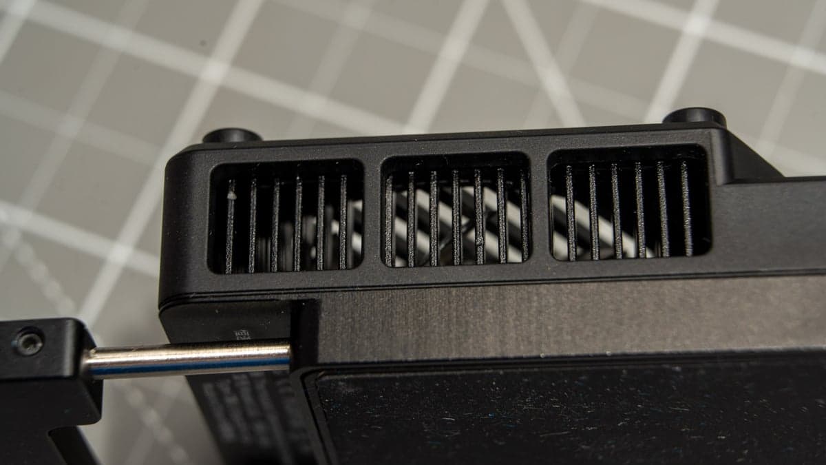 CNC-machined aluminum heatsink fin exhaust array dissipating thermal energy pulled away by the Peltier semiconductor element