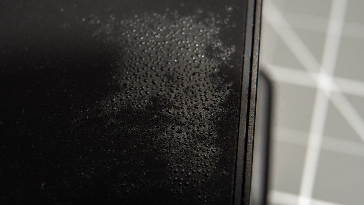Macro photograph showing actual atmospheric condensation droplets condensing across the cold Peltier surface